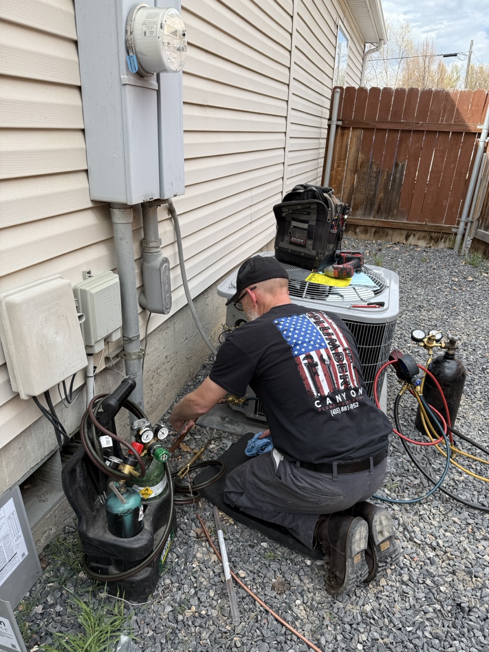 AC repair technician at work